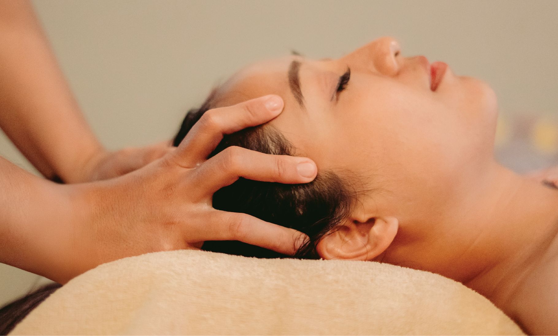 Guest receiving a head massage